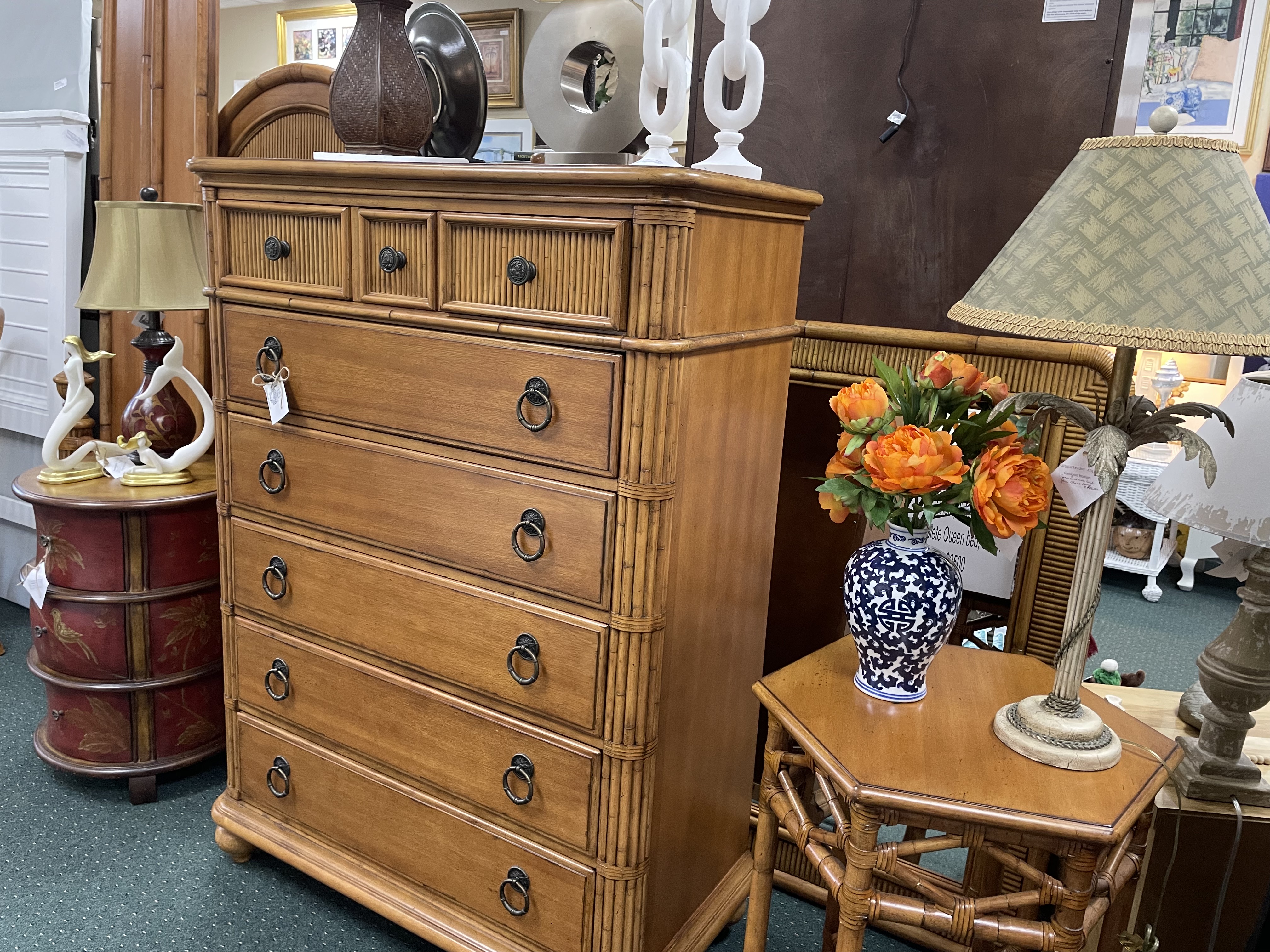 Large wooden chest of drawars and wooden end table with lamps and accessories